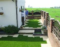 Kwik Kerb just finishing the two difficult Artificial Grass sections